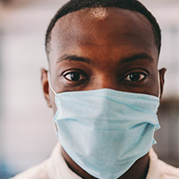 Masked lab technician