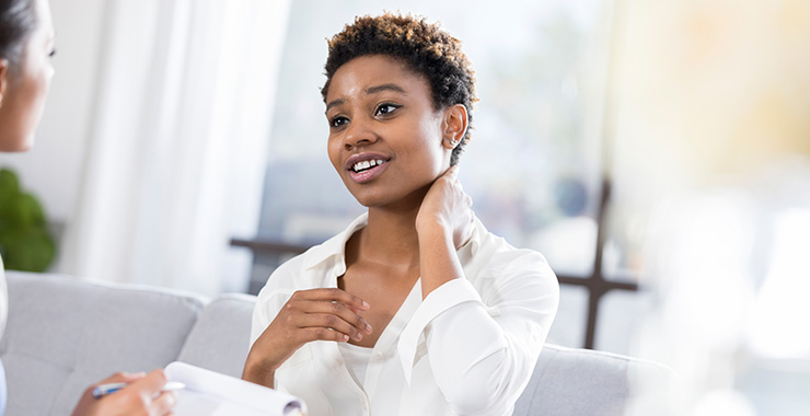 Young woman talking with counselor