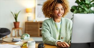 A young woman working on her computer
