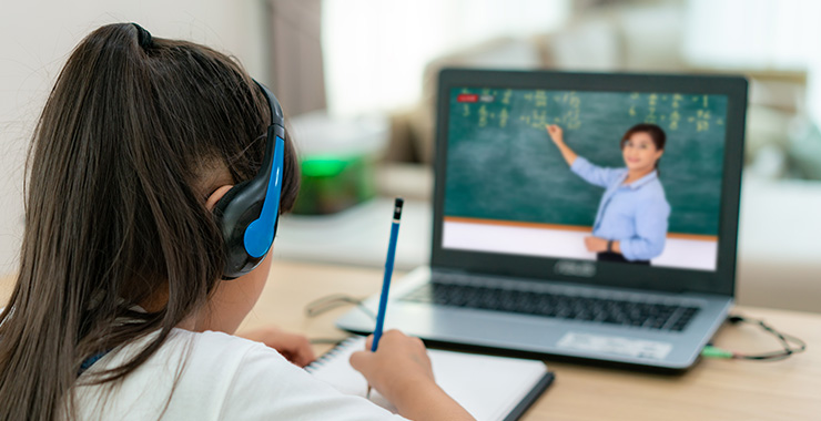 Student doing distance learning on a laptop