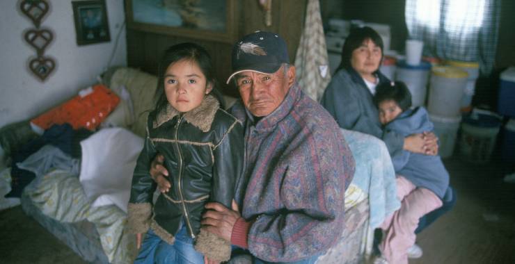Native American grandfather and granddaughter on reservation 