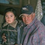 Native American grandfather and granddaughter on reservation 