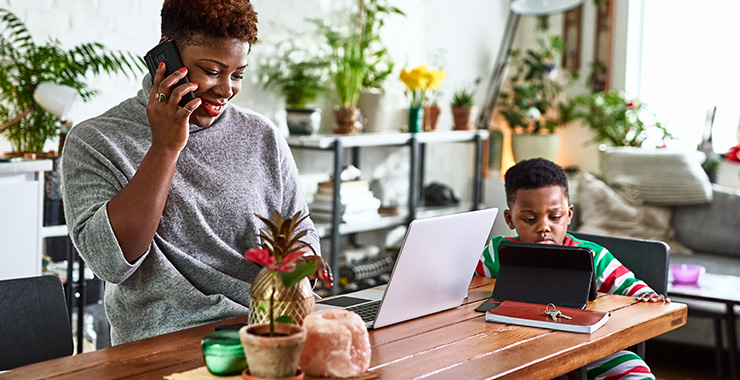 Woman and son with laptop computer