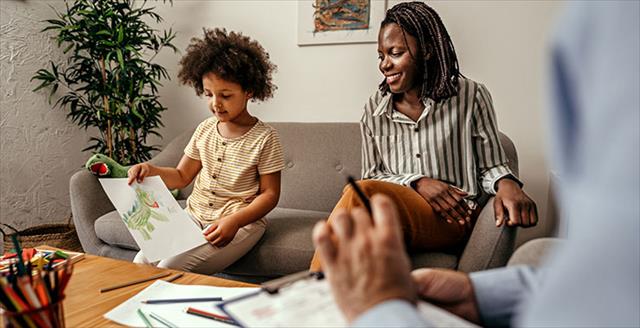 woman having a therapy session for her daughter with psychologist