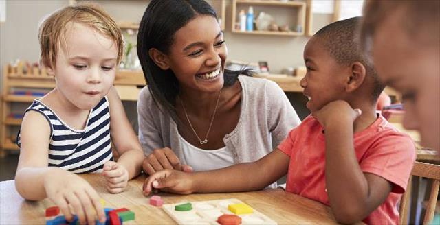 teacher with young students