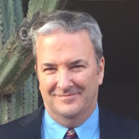 Headshot of Greg Shrader.