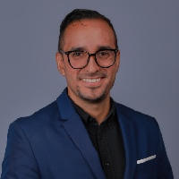 Headshot of Héctor D. Torres Ruiz.