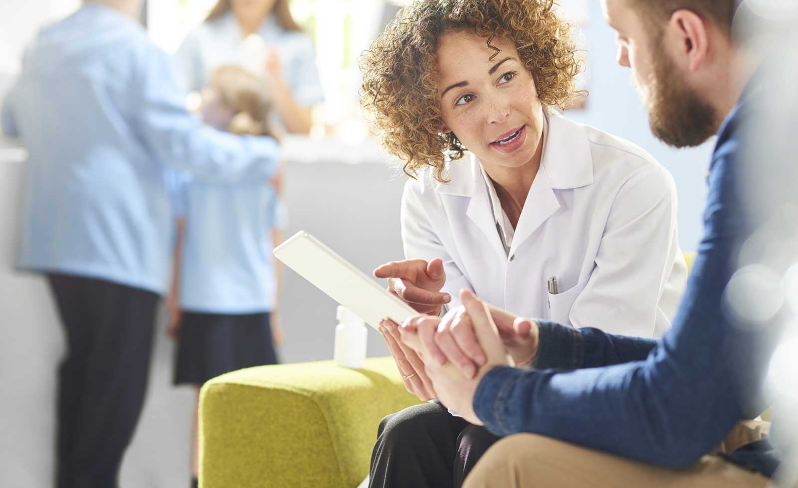 Medical professionals reviewing charts