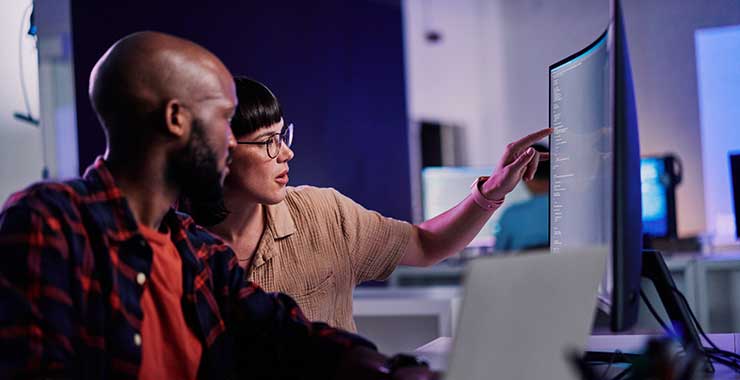 people working together at computer screen
