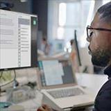 man looking at a computer screen