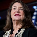 Reps. Diana DeGette (D-CO), in front of the American flag