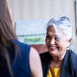 Older female adult in a business meeting