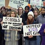 A group of young people gathered at a protest advocating for gun violence prevention