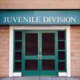 Double door entrance to a juvenile division building.