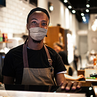 Restaurant employee wearing a face mask