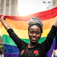 Woman holding LGBTQ pride flag