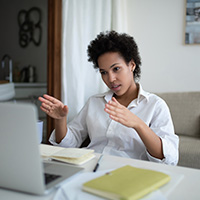 Woman working on laptop from home