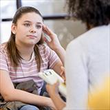Teen girl meeting with a psychologist