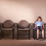 Elementary-aged girl sitting in a school office