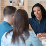 Woman talking to a few individuals