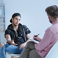 teen talking to professional