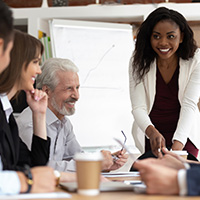 Woman smiling in a meeting