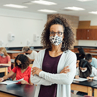 Teacher with mask in classroom