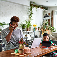 Woman and son with laptop computer