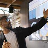 Man pointing to large computer screen