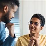 adult and teen in conversation