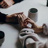 Close up hands embracing 
