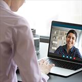 discussion between two women using a laptop