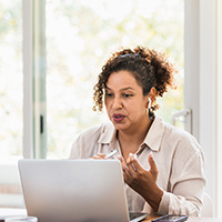 woman looking at laptop computer
