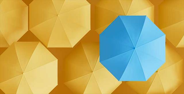 light blue umbrella on background of yellow umbrellas