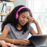 teen girl looking at tablet computer