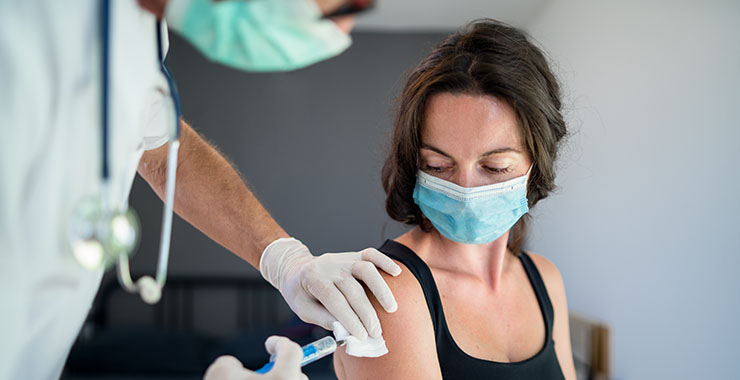 woman receiving a vaccine