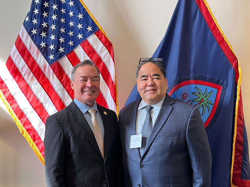 Juan Rapadas, PhD, poses with Del. James Moylan (R-Guam)