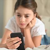 girl looking at mobile phone
