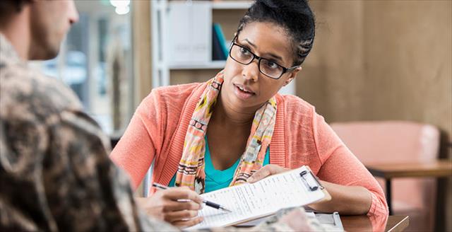 female therapist in counseling session with a military veteran