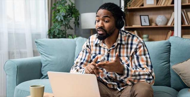 Black male therapist conducting teletherapy session