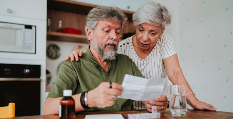 Senior couple looking at a medical bill
