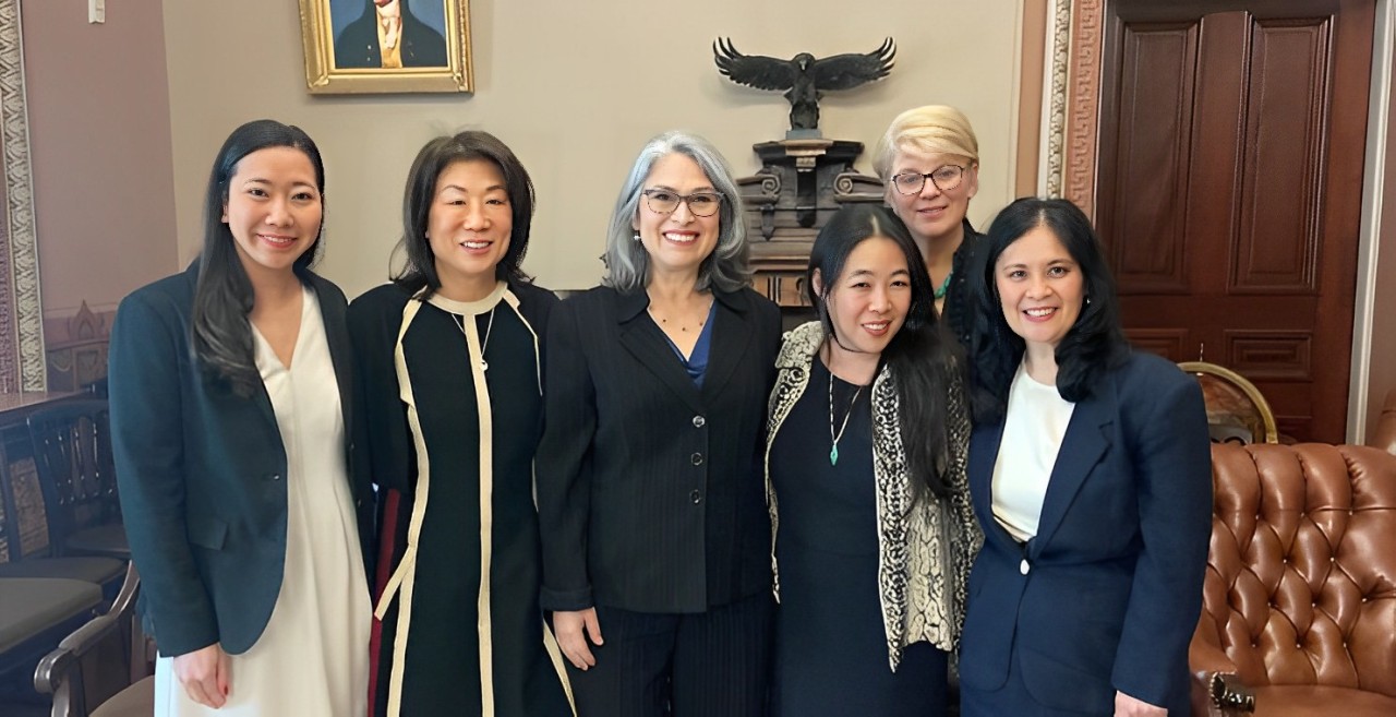 Cynthia de las Fuentes, PhD, and Debra Kawahara, PhD, with Biden administration officials