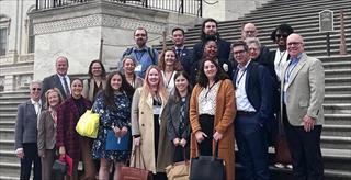 APA members standing on the steps of the U.S. Capitol