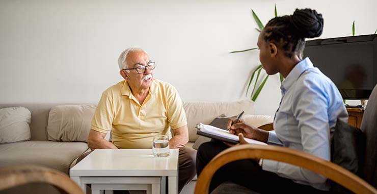 Health care specialist talking with older person