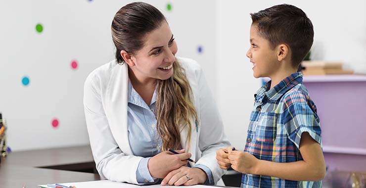 Child psychologist with young boy