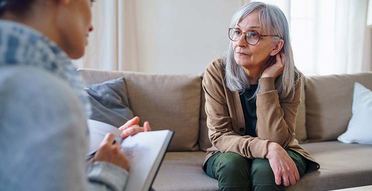 Psychologist meeting with older client