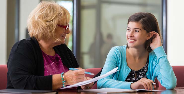Young woman talking with a guidance counselor