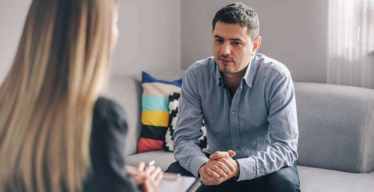 Man speaking with psychologist