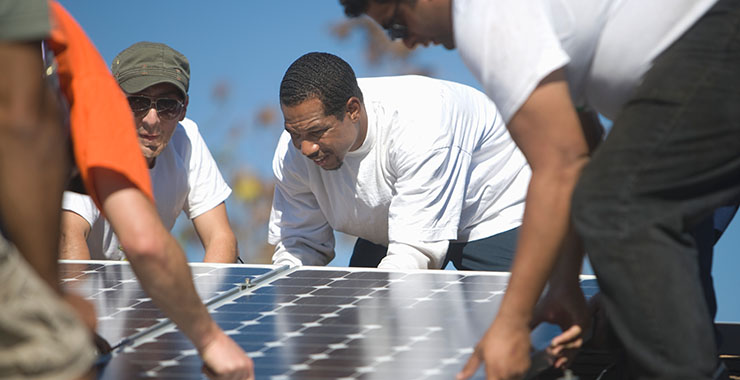 Men installing solar panels