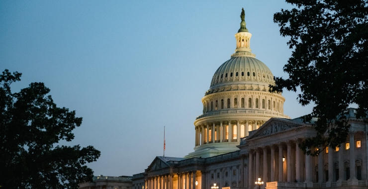 U.S. Capitol Building at dusk, with the dome illuminated.